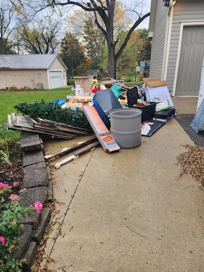 Dumpster being loaded with debris for Roofing Dumpster Rental in Moultonborough